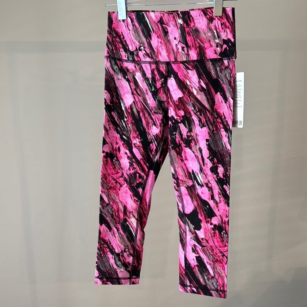 Lululemon Pink and Black Wunder Train HR 21” Crop Leggings